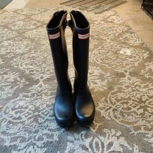 Black tall hunter boots
